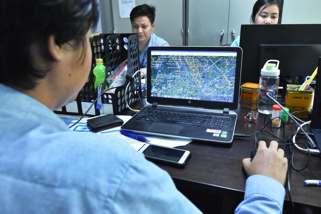 Staff at the Global Technology headquarters in Yangon. (Steve Tickner | Frontier)